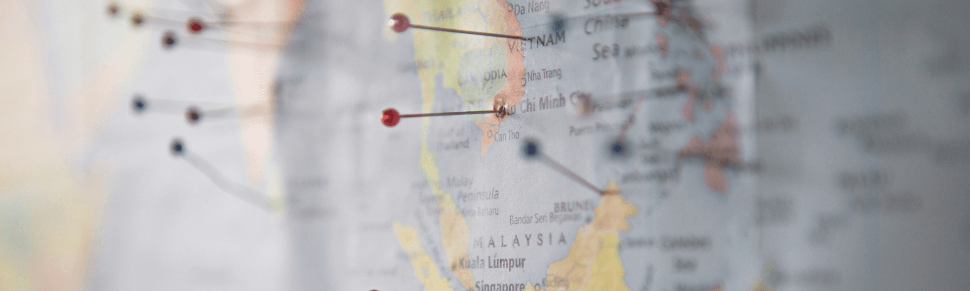 Close-up of a world map focused on Southeast Asia with location markers, symbolizing global market presence